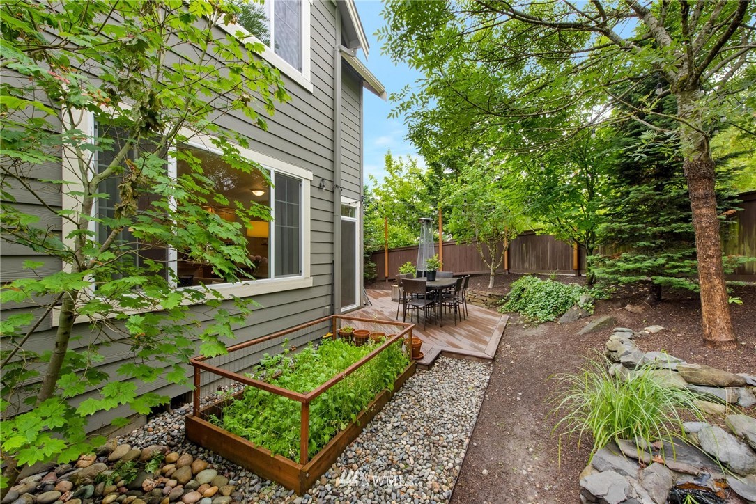 16203 41st Drive Southeast Bothell, WA 98012 - Photo 20 of 20 a view of a chair and table in backyard of the house