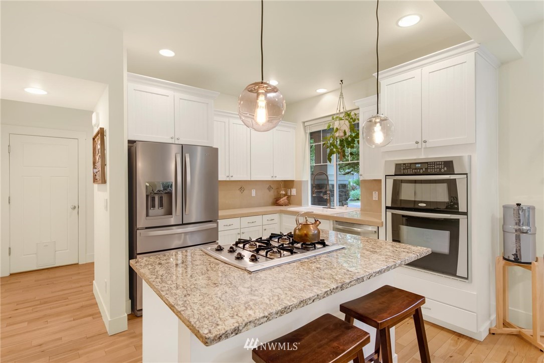 16203 41st Drive Southeast Bothell, WA 98012 - Photo 3 of 20 a kitchen with a stove a refrigerator and a stove