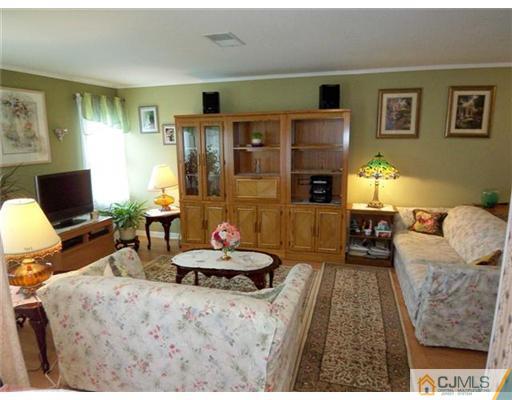 1219 Edpas Road New Brunswick, NJ 08901 - Photo 3 of 14 a bedroom with furniture and a fireplace