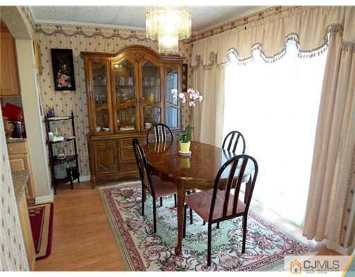 1219 Edpas Road New Brunswick, NJ 08901 - Photo 4 of 14 a view of a dining room with furniture