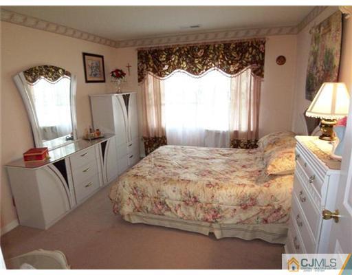 1219 Edpas Road New Brunswick, NJ 08901 - Photo 6 of 14 a bedroom with a bed and a window