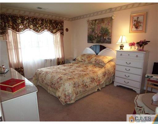 1219 Edpas Road New Brunswick, NJ 08901 - Photo 7 of 14 a bedroom with a bed dresser and window