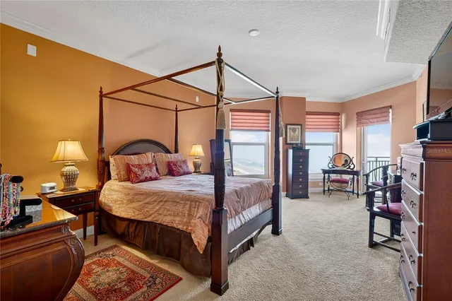 a bed room with a bed and a television