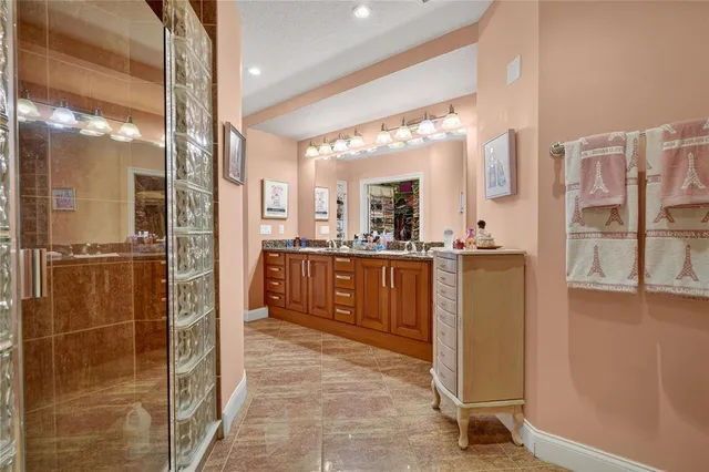 a bathroom with a shower and a sink