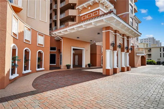 a view of room with hardwood floor and front door