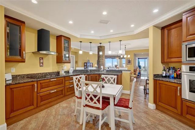 a kitchen with a refrigerator stove and a sink