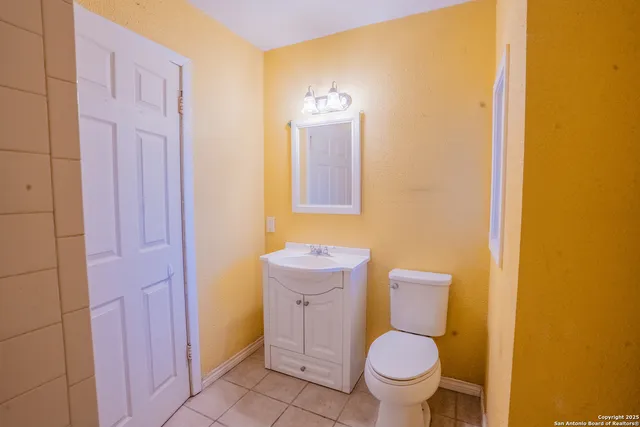 a bathroom with a toilet and a sink