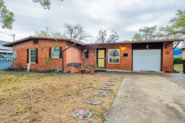 a backyard of a house with barbeque oven fire pit and outdoor seating