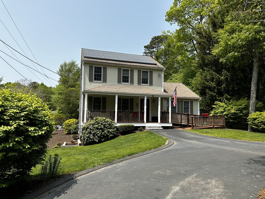 1 Park Road, Unit 1 Sandwich, MA 02644 - Photo 1 of 25 a front view of a house with garden