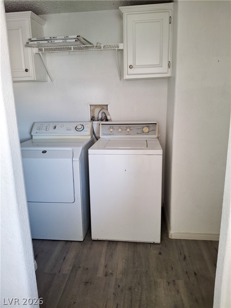 4550 Horn Road Pahrump, NV 89048 - Photo 12 of 12 This dedicated laundry space features convenient storage cabinetry and durable flooring for everyday utility.