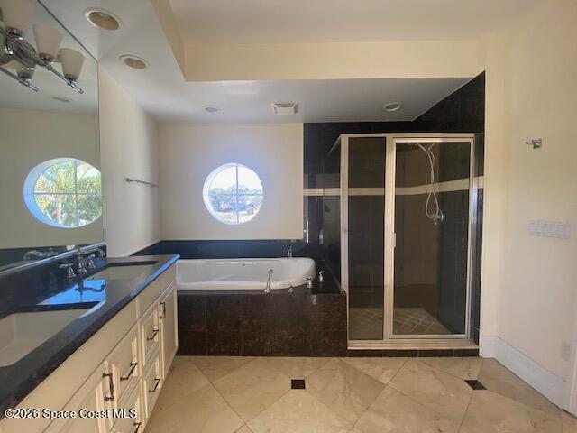 2240 Front Street, Unit 104 Melbourne, FL 32901 - Photo 16 of 37 a bathroom with a sink a mirror and a bathtub