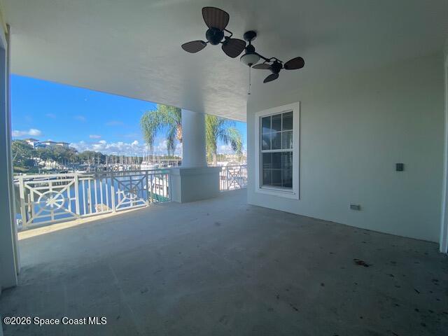 2240 Front Street, Unit 104 Melbourne, FL 32901 - Photo 18 of 37 a view of a room with a floor to ceiling window and ceiling fan