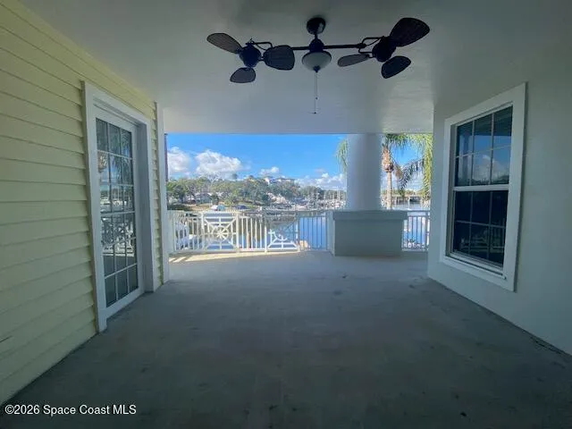 a view of a chairs and table in patio