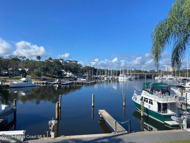 a view of a lake with a table and chairs