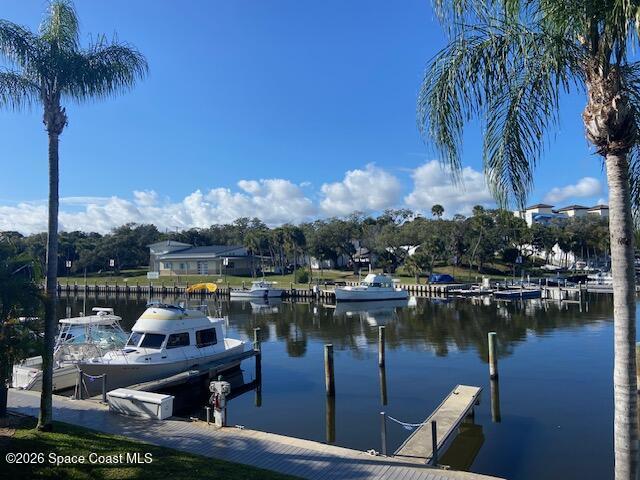 2240 Front Street, Unit 104 Melbourne, FL 32901 - Photo 23 of 37 a view of a lake with a table and chairs
