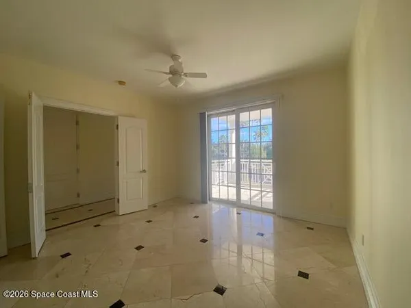 a view of a balcony with furniture