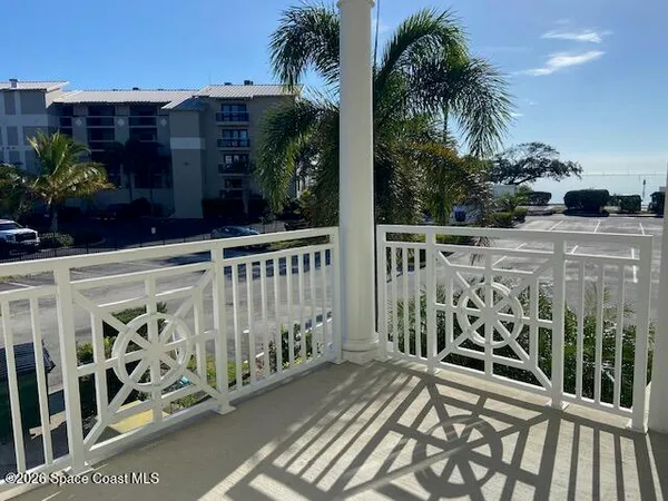 a bathroom with a granite countertop sink a toilet a mirror and shower