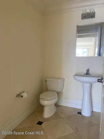 a bathroom with a toilet and a sink