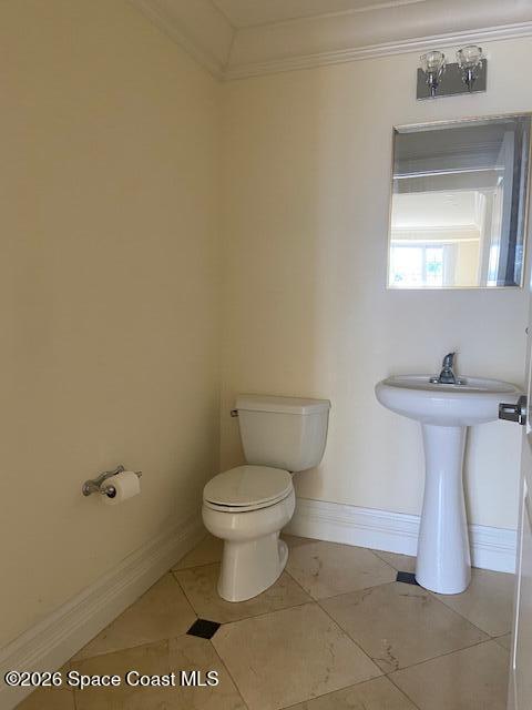 2240 Front Street, Unit 104 Melbourne, FL 32901 - Photo 7 of 37 a bathroom with a toilet and a sink