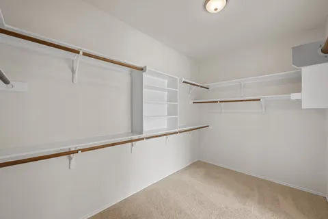 a view of an empty walk in closet
