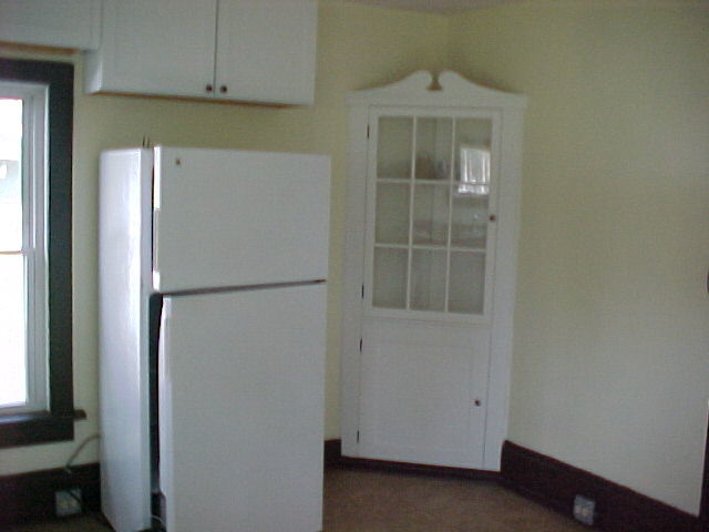340 Ogden Street Capron, IL 61012 - Photo 3 of 11 a white refrigerator freezer and a window