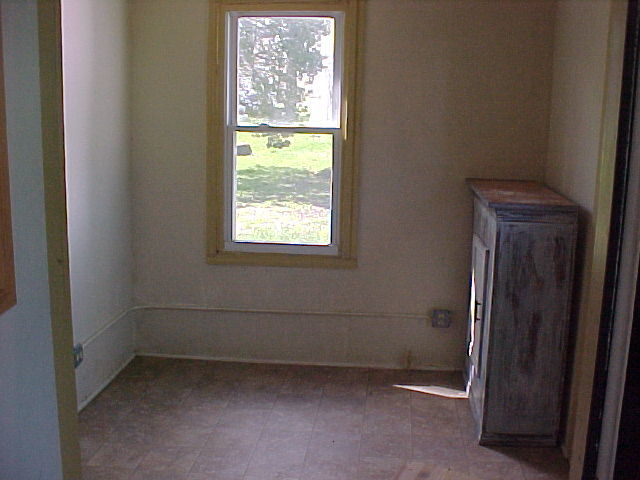 340 Ogden Street Capron, IL 61012 - Photo 5 of 11 a room that has a window in it