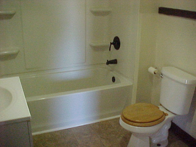 340 Ogden Street Capron, IL 61012 - Photo 9 of 11 a bathroom with a sink and a toilet