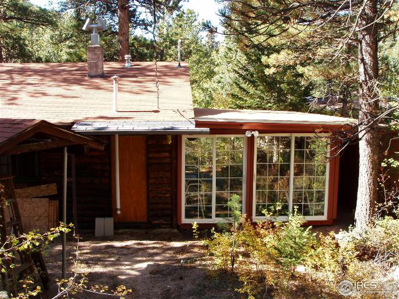 2426 Riverside Drive Lyons, CO 80540 - Photo 2 of 9 a view of a house with a tree