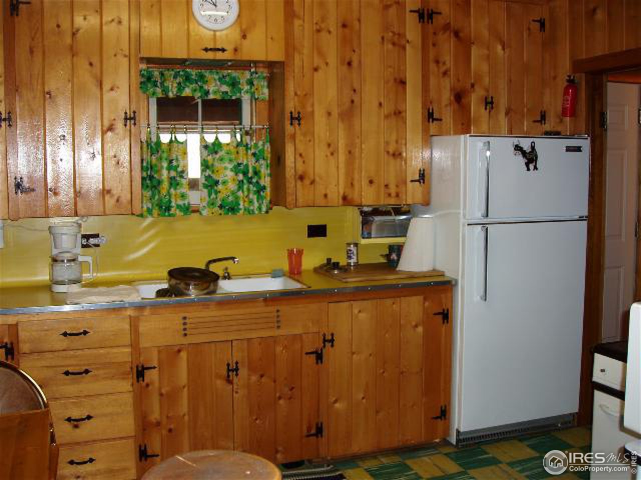 2426 Riverside Drive Lyons, CO 80540 - Photo 4 of 9 a kitchen with appliances a sink and cabinets