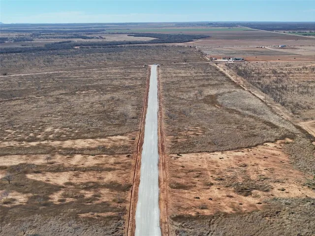 a view of beach and a yard