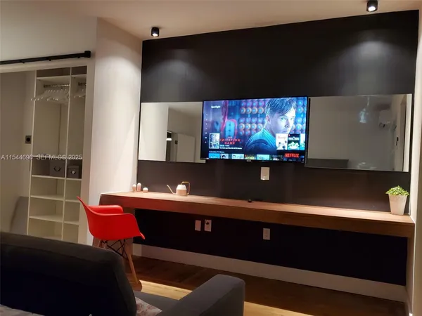 a room with furniture and screen