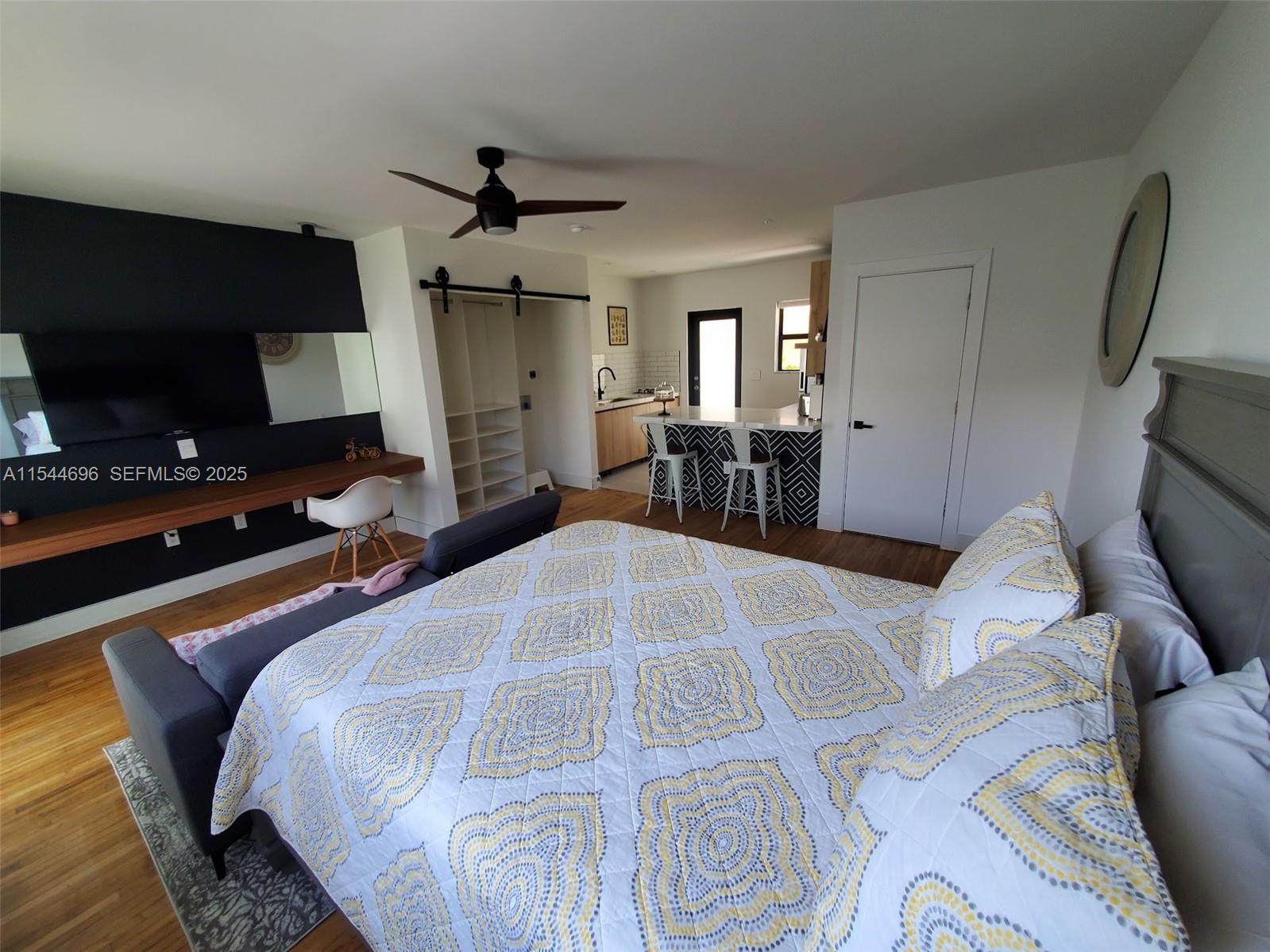 740 Southwest 9th Street, Unit 2 Miami, FL 33130 - Photo 17 of 42 a living room with furniture and a flat screen tv