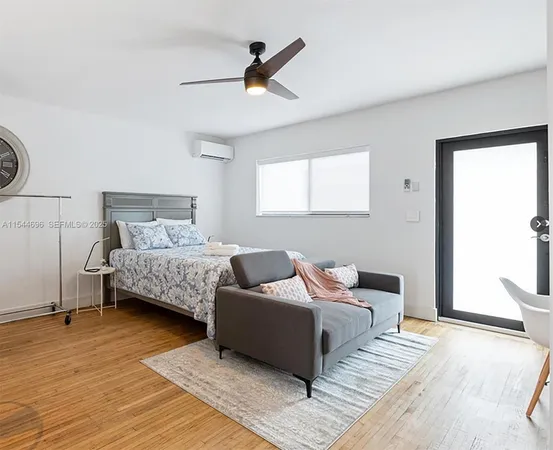 a bedroom with bed and window