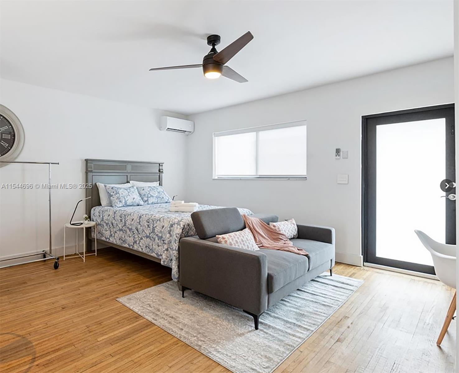 740 Southwest 9th Street, Unit 2 Miami, FL 33130 - Photo 2 of 42 a bedroom with bed and window