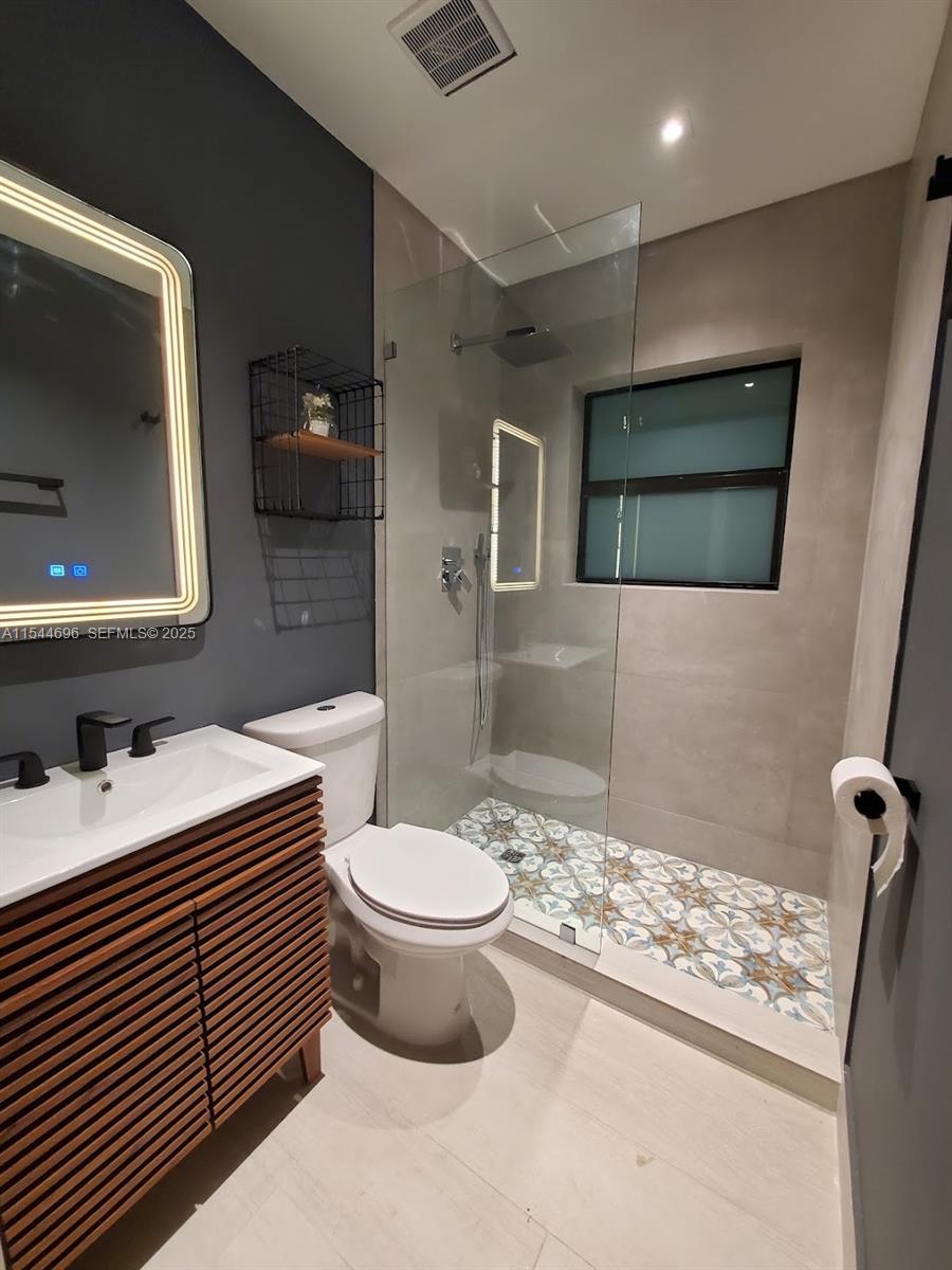 740 Southwest 9th Street, Unit 2 Miami, FL 33130 - Photo 10 of 42 a bathroom with a sink toilet and shower