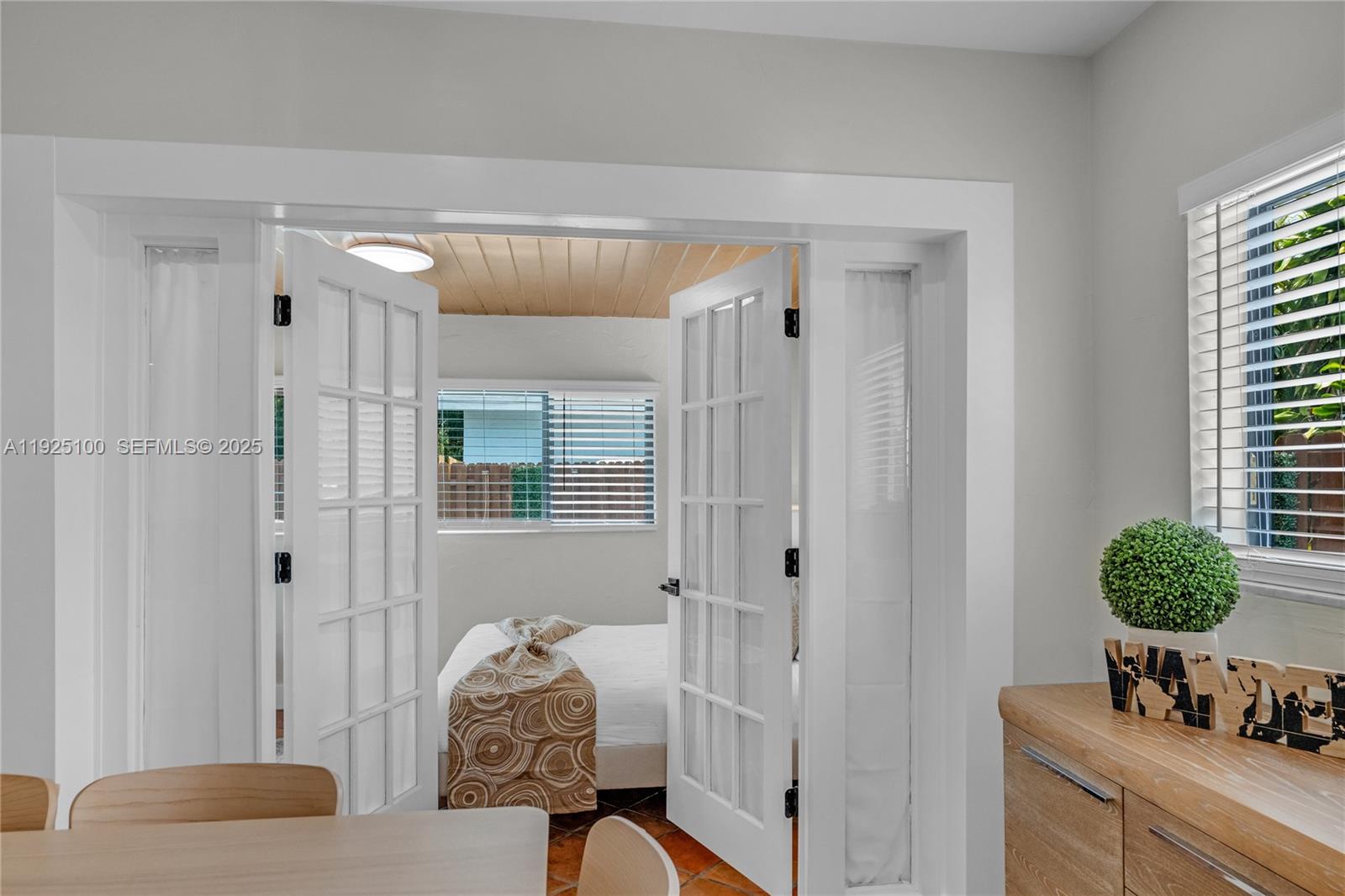1204 Northeast 7th Street Pompano Beach, FL 33060 - Photo 25 of 43 a living room with furniture and a potted plant