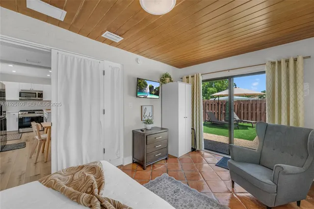 a bedroom with furniture and a bed