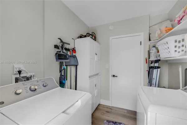 a utility room with dryer and washer