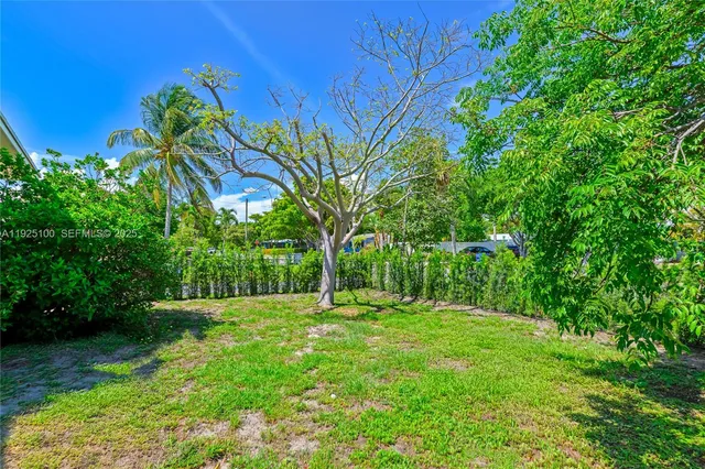 a view of a chair and table on the wooden deck
