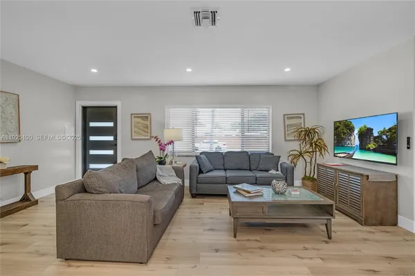 a living room with furniture and a window