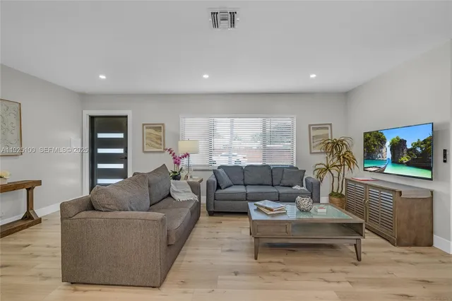 a living room with furniture and a window