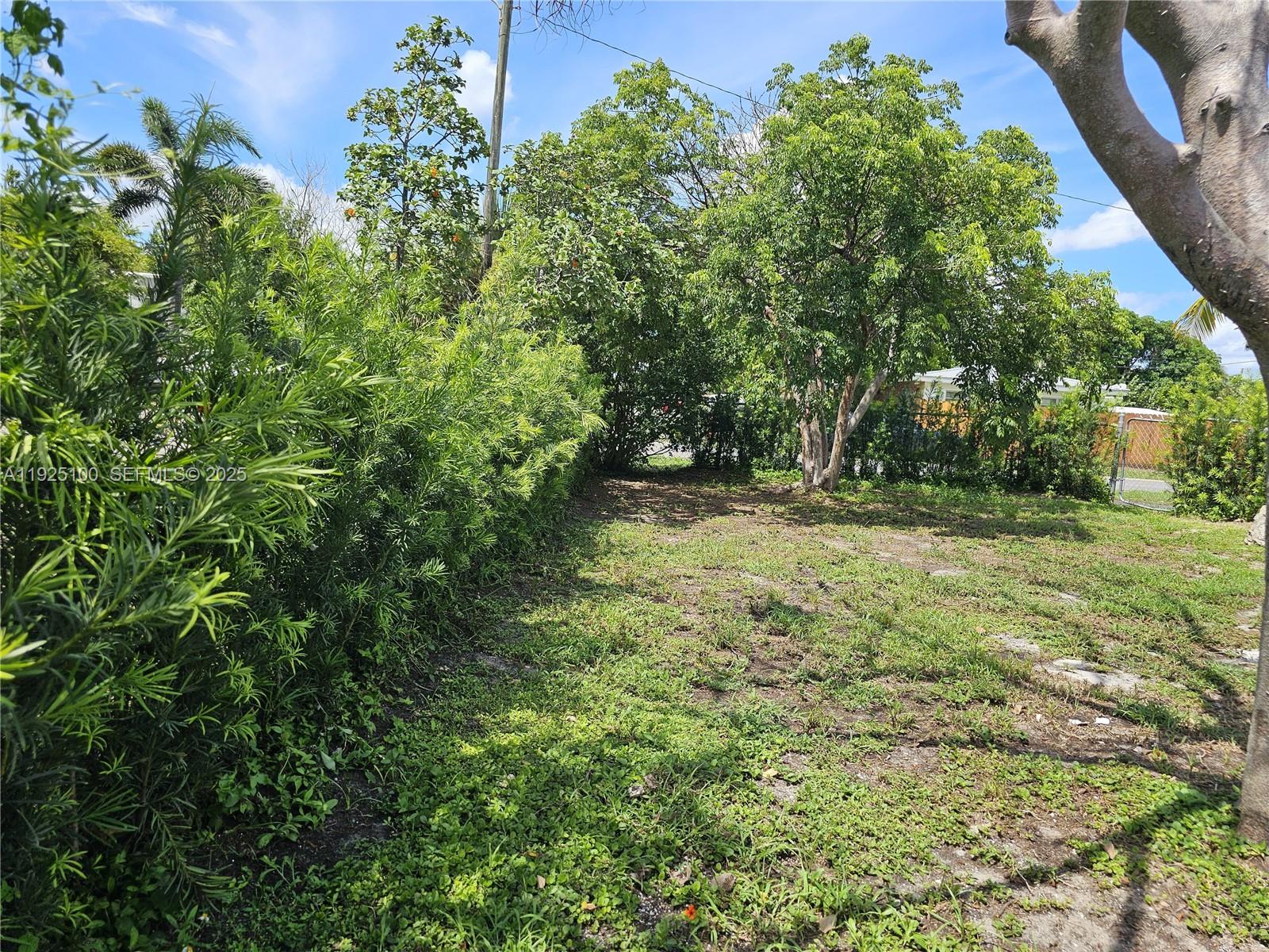 1204 Northeast 7th Street Pompano Beach, FL 33060 - Photo 43 of 43 a view of outdoor space with deck and yard
