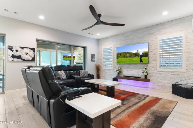 a large kitchen with kitchen island a sink a counter top space and stainless steel appliances