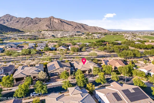 a living room with furniture flat screen tv and a large window