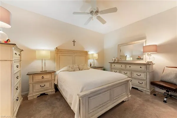a bedroom with a bed and a cabinets