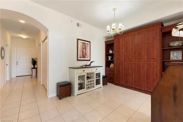 a view of a kitchen with furniture and chandelier