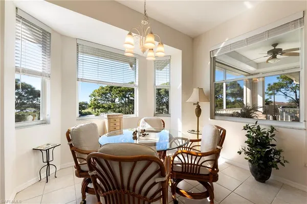 a dining room with furniture and window