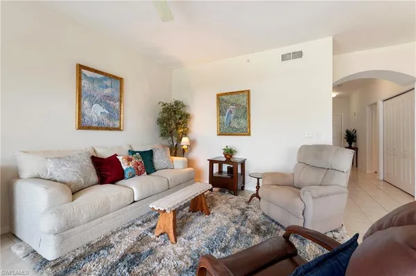a living room with furniture and a couch