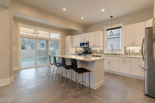 a kitchen with counter top space and appliances