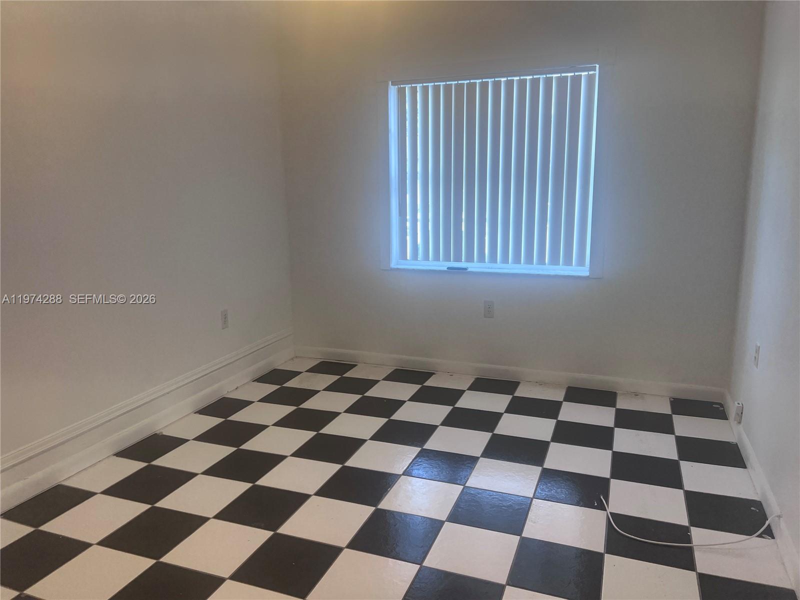 26120 Southwest 130th Avenue Homestead, FL 33032 - Photo 18 of 34 a black and white checkered floor with a black white checkered floor